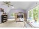 Charming bedroom with a bunk bed, desk, ceiling fan, and two windows providing an airy and bright space at 1332 Kinsdale Dr, Raleigh, NC 27615
