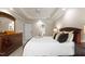 Bedroom featuring a king bed, dresser, and a tray ceiling at 1332 Kinsdale Dr, Raleigh, NC 27615