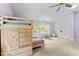 This bedroom features a bunk bed with built-in storage, a desk by the window, and a double-door closet at 1332 Kinsdale Dr, Raleigh, NC 27615