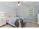 Bedroom featuring a full bed, night stand and two windows at 1332 Kinsdale Dr, Raleigh, NC 27615