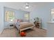bedroom with carpet, a twin bed and a view of two windows at 1332 Kinsdale Dr, Raleigh, NC 27615