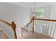 This is a view of the entryway from the second floor with a hanging light fixture at 1332 Kinsdale Dr, Raleigh, NC 27615