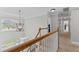 Second floor hallway with hardwood trim and view of hanging pendant light at 1332 Kinsdale Dr, Raleigh, NC 27615