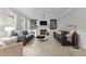 Bright living room features a cozy fireplace, built-in shelves, and plush seating at 1332 Kinsdale Dr, Raleigh, NC 27615