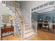 Elegant staircase with carpeted treads and white risers, leading to an office space at 1332 Kinsdale Dr, Raleigh, NC 27615
