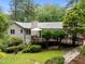 Expansive deck and lush backyard ideal for outdoor living and entertaining at 1706 Rangecrest Rd, Raleigh, NC 27612