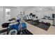Spacious basement featuring a drum set, gym equipment, and a mirrored wall for enhanced workouts at 1706 Rangecrest Rd, Raleigh, NC 27612