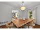 Bright dining room featuring hardwood floors and views to the living room at 1706 Rangecrest Rd, Raleigh, NC 27612