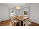 Elegant dining room features hardwood floors and stylish pendant lighting at 1706 Rangecrest Rd, Raleigh, NC 27612