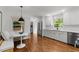 Bright kitchen features a cozy breakfast nook, stainless steel appliances, and hardwood floors at 1706 Rangecrest Rd, Raleigh, NC 27612