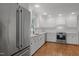 Spacious kitchen features stainless steel appliances, white cabinets, and subway tile backsplash at 1706 Rangecrest Rd, Raleigh, NC 27612