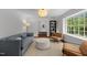 Cozy living room with light-filled window and stylish decor at 1706 Rangecrest Rd, Raleigh, NC 27612