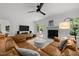 Inviting living room with a modern ceiling fan and cozy decor at 1706 Rangecrest Rd, Raleigh, NC 27612