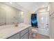 Bathroom featuring double sinks, granite countertops, and a shower-tub combination at 1779 Walter Grissom Rd, Kittrell, NC 27544