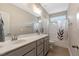 Bathroom featuring double sinks, granite countertops, and a shower-tub combination at 1779 Walter Grissom Rd, Kittrell, NC 27544