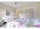 Comfortable bedroom with a floral bedspread, white furniture, and ample closet space at 1779 Walter Grissom Rd, Kittrell, NC 27544