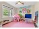 Playful bedroom with decorative murals and plenty of natural light at 1779 Walter Grissom Rd, Kittrell, NC 27544