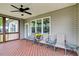 Covered deck with comfortable seating and peaceful views, creating an inviting outdoor living space at 1779 Walter Grissom Rd, Kittrell, NC 27544