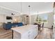 Open concept kitchen and living area with island seating and a connected living space at 1779 Walter Grissom Rd, Kittrell, NC 27544