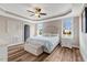 Luxurious main bedroom with trey ceilings, hardwood floors, and plenty of natural light at 1779 Walter Grissom Rd, Kittrell, NC 27544
