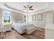 Comfortable main bedroom with tray ceiling, fan, and ensuite bathroom at 1779 Walter Grissom Rd, Kittrell, NC 27544