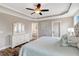 Bright main bedroom with ceiling fan and ensuite bathroom at 1779 Walter Grissom Rd, Kittrell, NC 27544