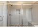 Modern tiled shower with glass door and built-in bench at 1779 Walter Grissom Rd, Kittrell, NC 27544