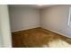 An empty bedroom with neutral walls and wall-to-wall carpeting at 1942 Brier Ln, Graham, NC 27253