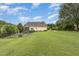 Beautiful backyard featuring a pool, deck, and manicured lawn at 20 Wood Ibis Way, Louisburg, NC 27549