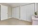Neutral bedroom featuring double bi-fold closet doors and white trim at 20 Wood Ibis Way, Louisburg, NC 27549