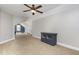 Large bonus room featuring neutral walls, ceiling fan, and natural light at 20 Wood Ibis Way, Louisburg, NC 27549