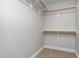 Spacious walk in closet features custom shelving for organization at 20 Wood Ibis Way, Louisburg, NC 27549