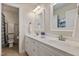 Bright bathroom features a double sink vanity with plenty of counter space at 200 Cobblepoint Way, Holly Springs, NC 27540