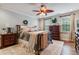 Serene bedroom with a ceiling fan, hardwood floors, and ample natural light at 200 Cobblepoint Way, Holly Springs, NC 27540