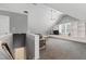 Spacious bonus room featuring built-in shelving and a cozy window seat at 200 Cobblepoint Way, Holly Springs, NC 27540