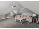 Bonus room with lots of floor space, dormer windows, and a couch at 200 Cobblepoint Way, Holly Springs, NC 27540