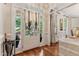 Elegant entryway featuring hardwood floors, natural light, and stylish decor at 200 Cobblepoint Way, Holly Springs, NC 27540