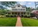 Beautiful two-story house with a classic design and an inviting front porch at 200 Cobblepoint Way, Holly Springs, NC 27540