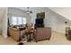 Inviting living room with a comfortable seating arrangement and entertainment center at 200 Cobblepoint Way, Holly Springs, NC 27540