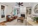 Comfortable living room featuring built-in shelving, a fireplace, and natural light at 200 Cobblepoint Way, Holly Springs, NC 27540