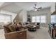 Comfortable living room with neutral tones and lots of natural light from large windows at 200 Cobblepoint Way, Holly Springs, NC 27540