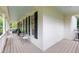 Spacious wraparound porch with outdoor seating, perfect for enjoying the outdoors at 200 Cobblepoint Way, Holly Springs, NC 27540
