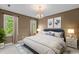 Comfortable bedroom with natural lighting, stylish decor, and a calming color palette at 2001 Dobson Ct, Raleigh, NC 27612