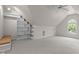 Large bonus room with natural light, vaulted ceilings, and ample storage space at 2001 Dobson Ct, Raleigh, NC 27612