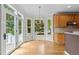 Breakfast nook with hardwood floors, lots of windows, and natural light at 2001 Dobson Ct, Raleigh, NC 27612
