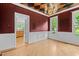 Dining room with chandelier, hardwood floors, and view to the kitchen at 2001 Dobson Ct, Raleigh, NC 27612