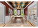 Stunning dining room with a checkered ceiling, elegant chandelier, and bright windows at 2001 Dobson Ct, Raleigh, NC 27612