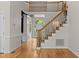 Elegant foyer with staircase and hardwood floors at 2001 Dobson Ct, Raleigh, NC 27612