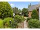 Professionally landscaped yard with stone pathway and mature trees at 2001 Dobson Ct, Raleigh, NC 27612