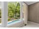 View of the swimming pool with waterfall feature and backyard from the window at 2001 Dobson Ct, Raleigh, NC 27612